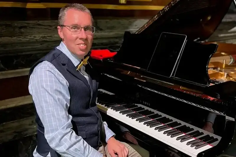 Jules Addison performing on a Steinway Grand Piano